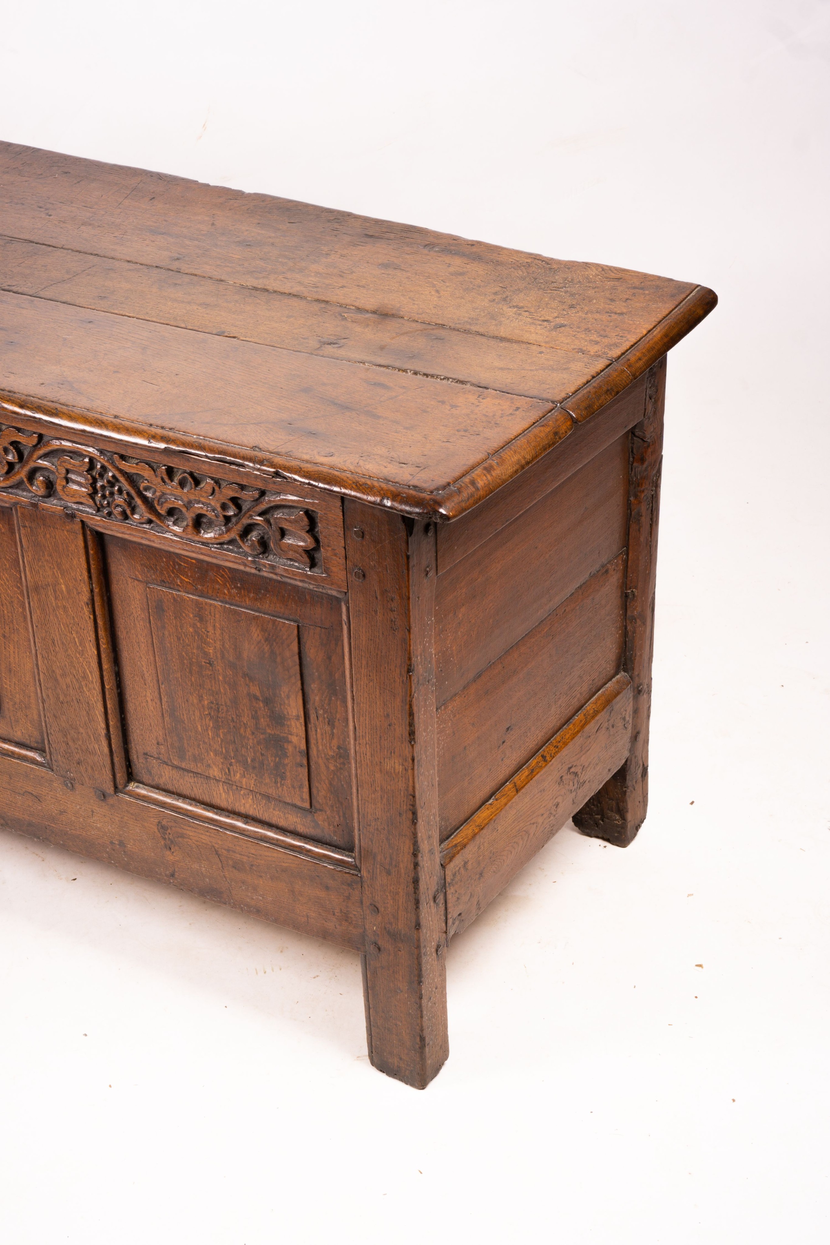 A 17th / 18th century carved oak coffer, length 132cm, depth 53cm, height 64cm